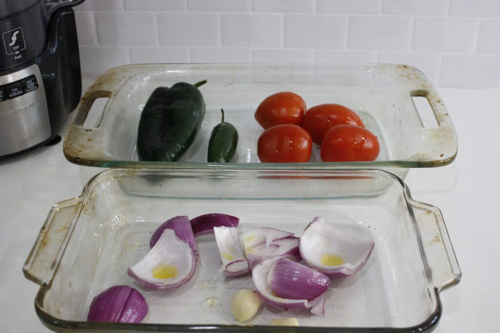 vegetables sit in a baking sheet