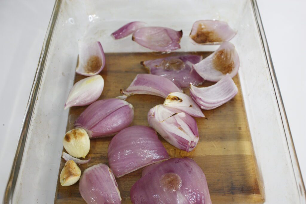 browned onions sit in a glass baking sheet