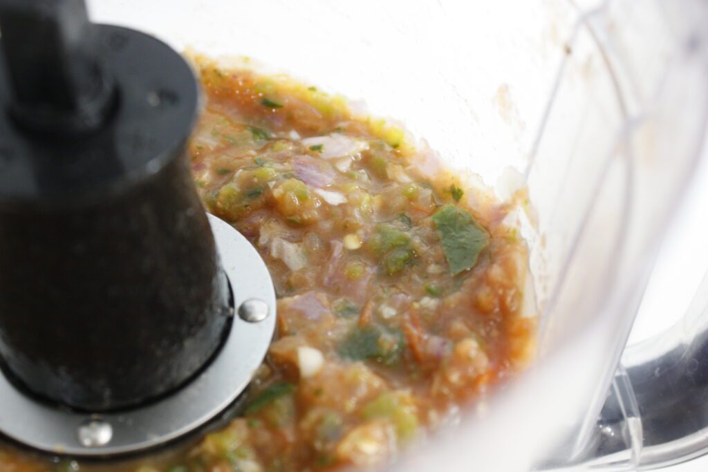 mixed salsa sits in a food processor